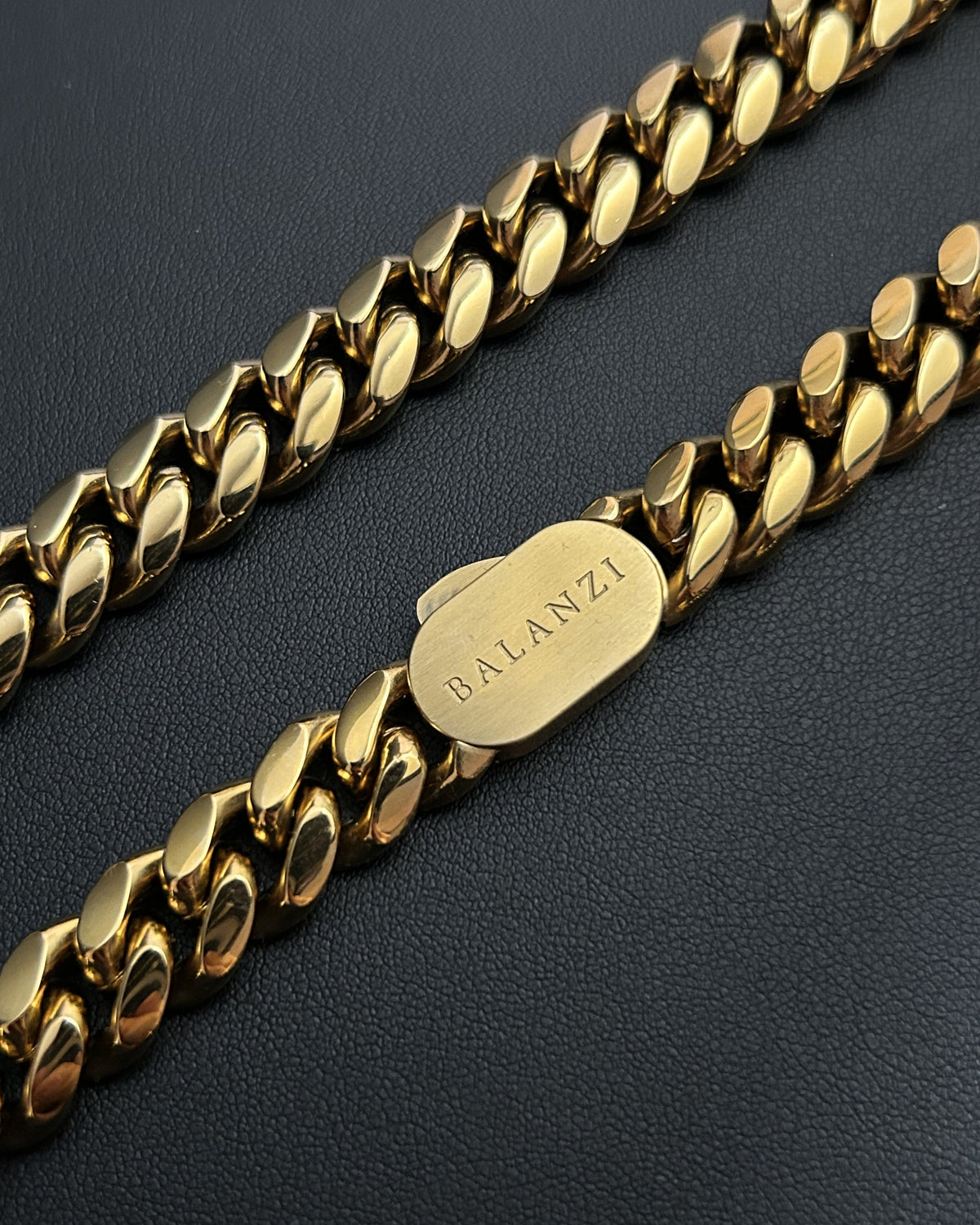 The BALANZI clasp tag on the 12mm Cuban link, close up