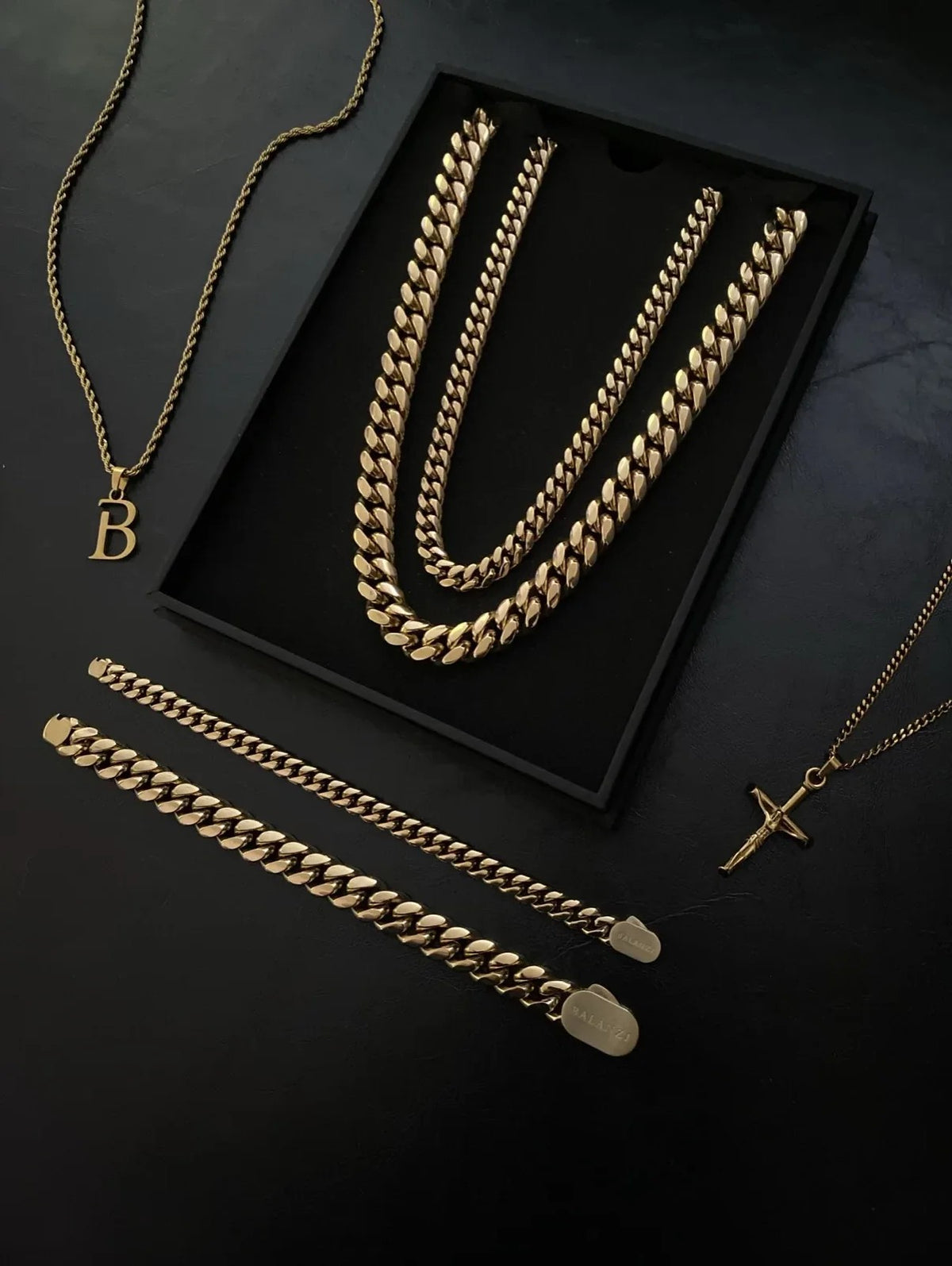 The Collection — full lineup in the Signature box: both Cuban chains, matching bracelets, crucifix